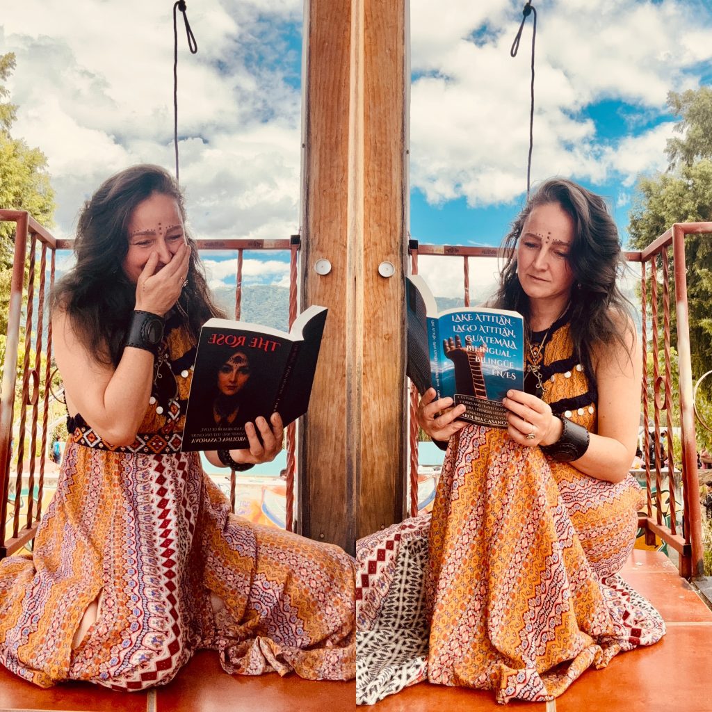 Carolina Casanova holding her books The Rose and Lake Atitlán, Guatemala